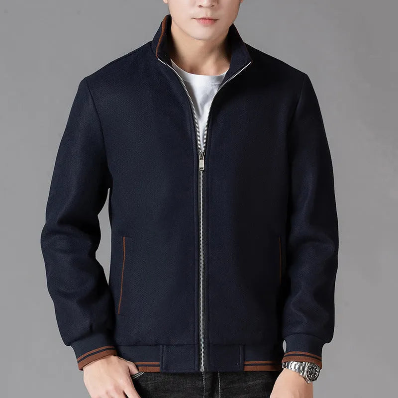 A grey men's sports-style fleece jacket with a stick pocket and long sleeves.