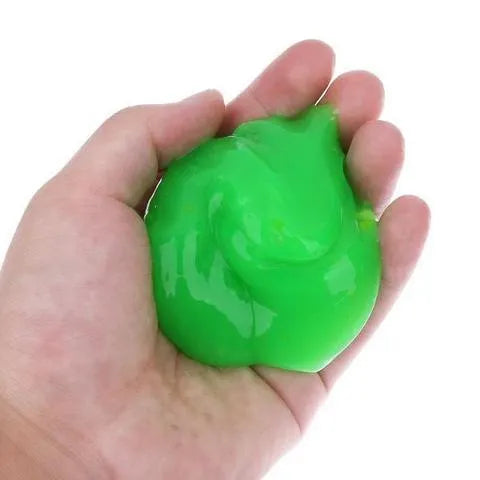 Blue and yellow magic cleaning gel putty for dust removal on a keyboard