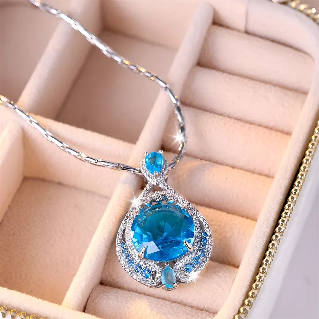 Women's geometric necklace with blue crystal gems on water wave chain