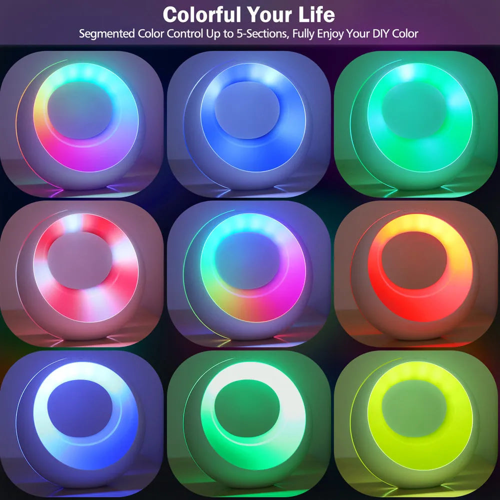 Small white RGB colour changing night lamp with remote control on a wooden desk.