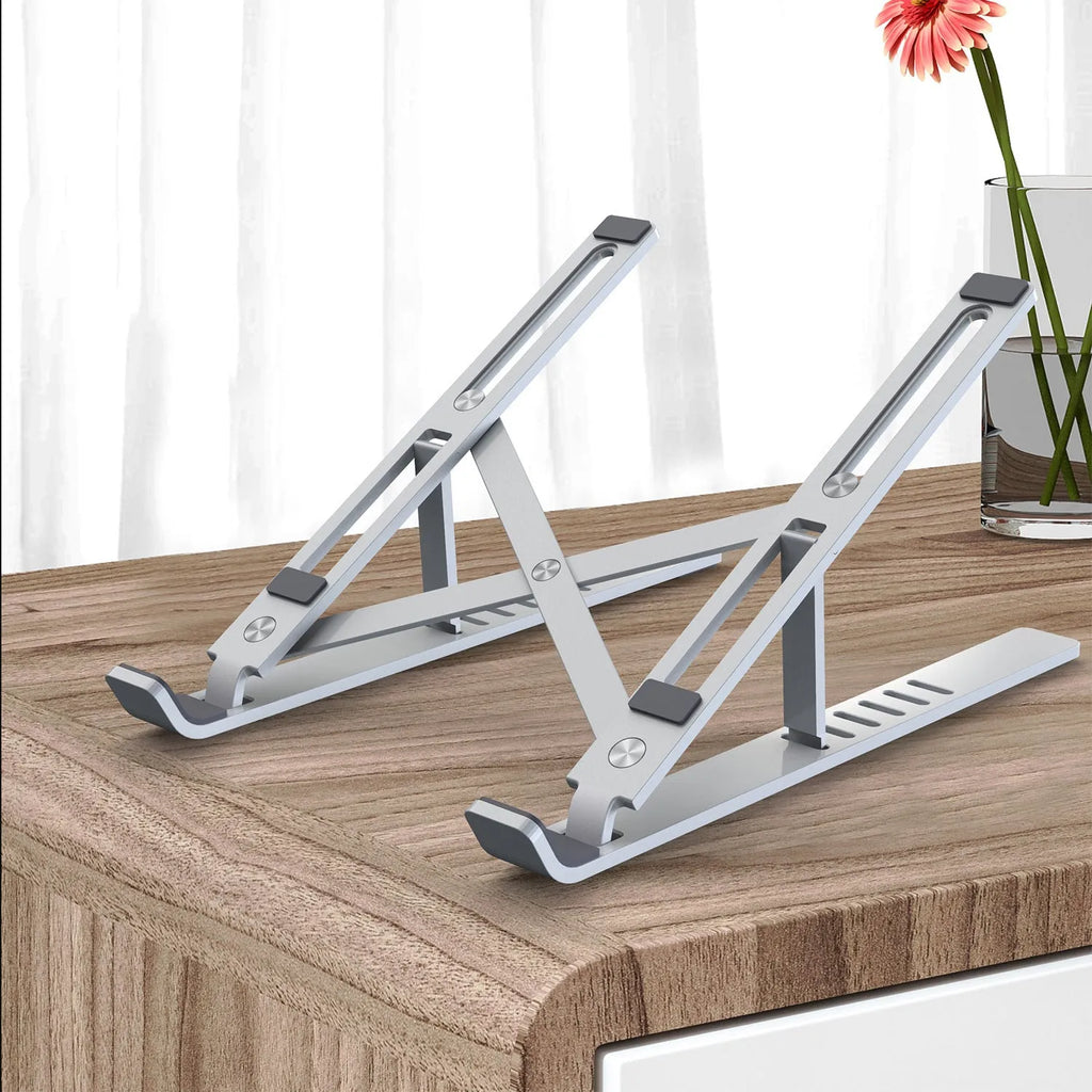 Silver aluminium laptop stand with six adjustable gear positions shown folded