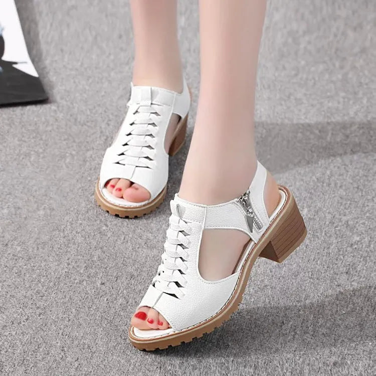 Retro women's sandals with a side zipper in black, shown on a foot, featuring a middle heel.