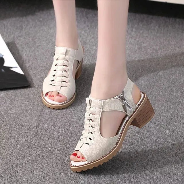 Retro women's sandals with a side zipper in black, shown on a foot, featuring a middle heel.