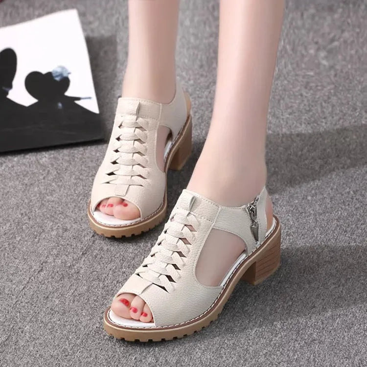 Retro women's sandals with a side zipper in black, shown on a foot, featuring a middle heel.