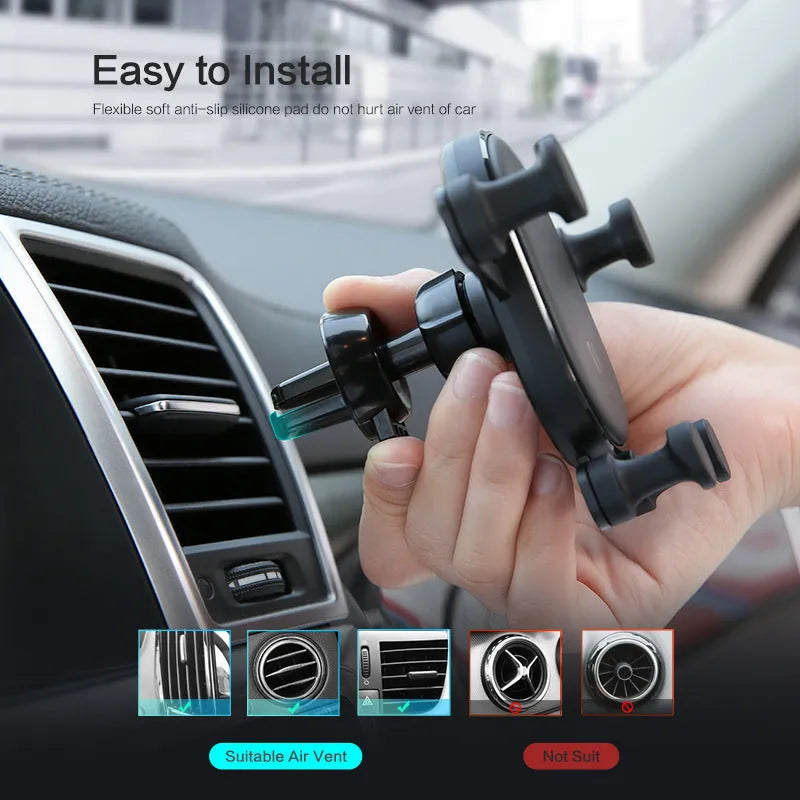Black gravity car phone holder mounted on car vent with smartphone secured in 360-degree rotating cradle