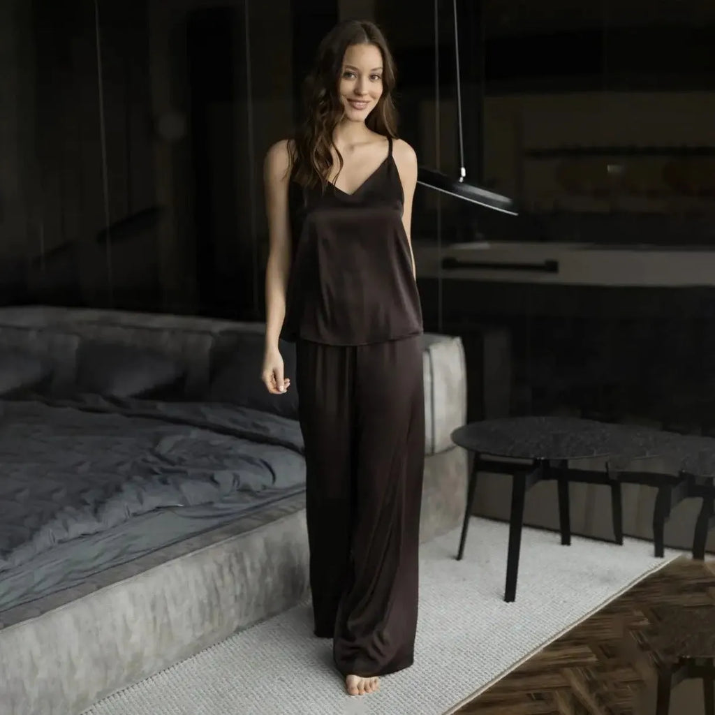 Polyester suspender trousers pyjama suit in navy blue with European American style top and matching trousers on model