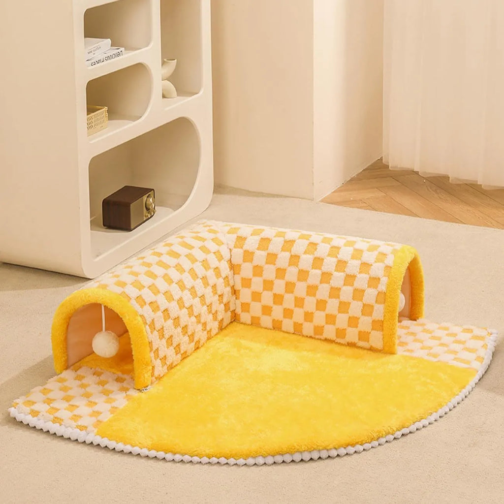 Fan shaped plush pet bed with integrated tunnel in plaid design, shown in coffee colour.