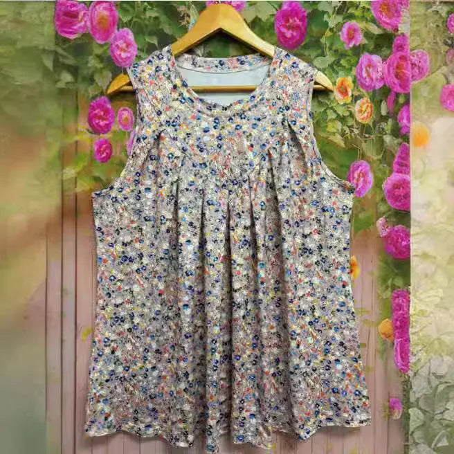 Black plus size sleeveless vest with floral print, shown on a hanger.