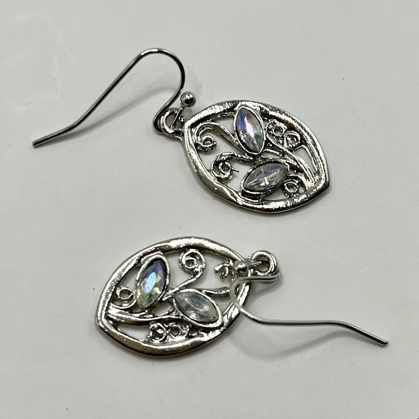 Silver colour leaves-shaped earrings with colourful moonstone embedded in centre