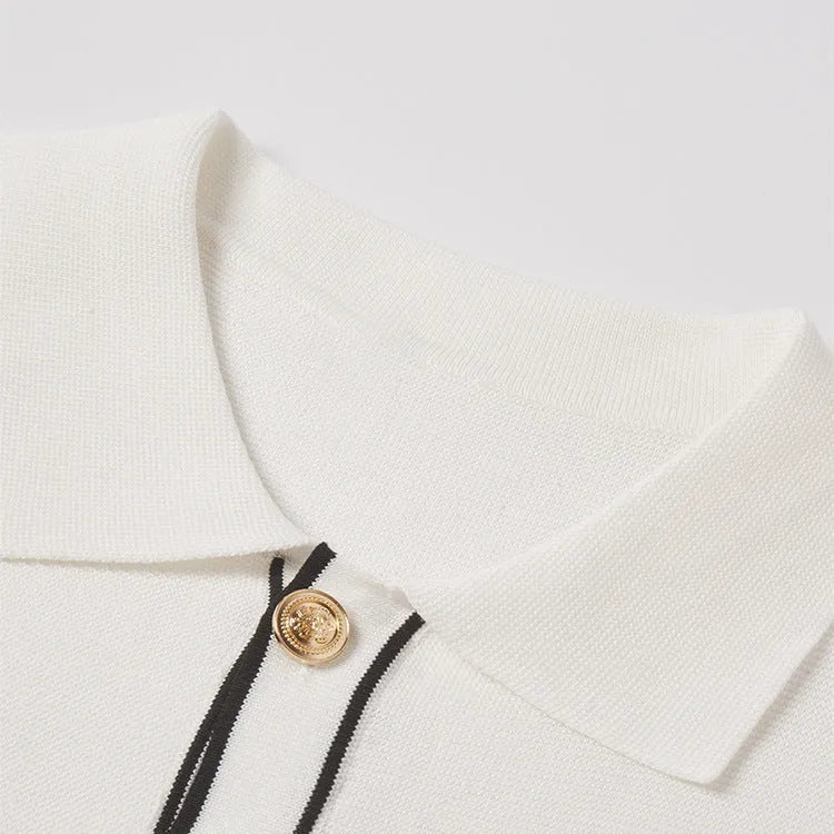 White short sleeve women's cardigan with a dark contrast lapel collar, shown open front.