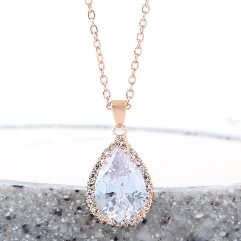 Geometric drop shape alloy necklace with rhinestone accents in rose gold pink finish