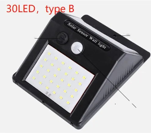 Solar powered outdoor garden lamp with motion sensor and 30 LED lights for automatic pathway illumination