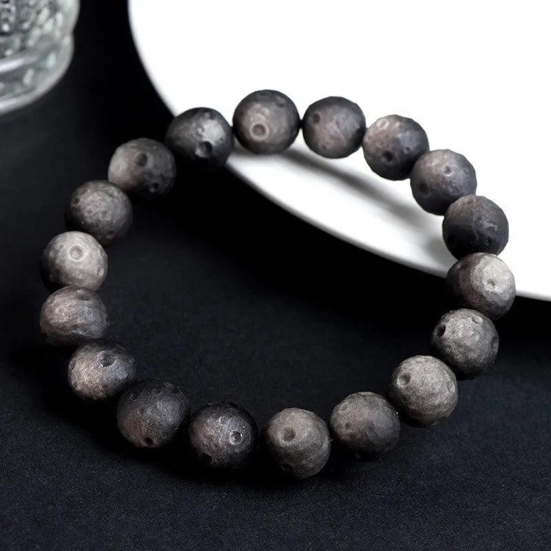 Natural obsidian crater ball bracelet with textured beads in silver or gold meteorite finish