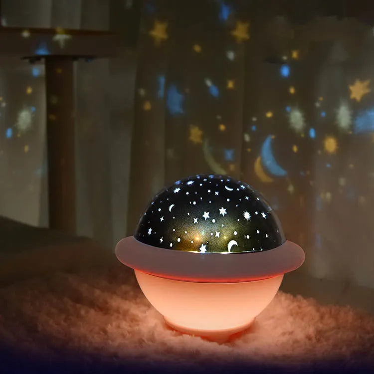 Green UFO-shaped starry sky projection lamp on a table with LED lights on