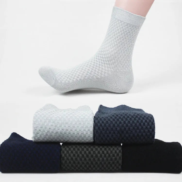 Men's bamboo fibre crew sock with small square pattern in black, navy, grey, and grey-blue colours.