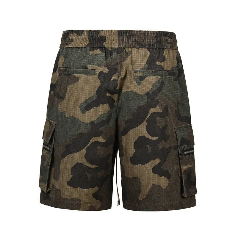 Men's green washed camouflage cotton workwear shorts with a loose fit on a mid-waist.