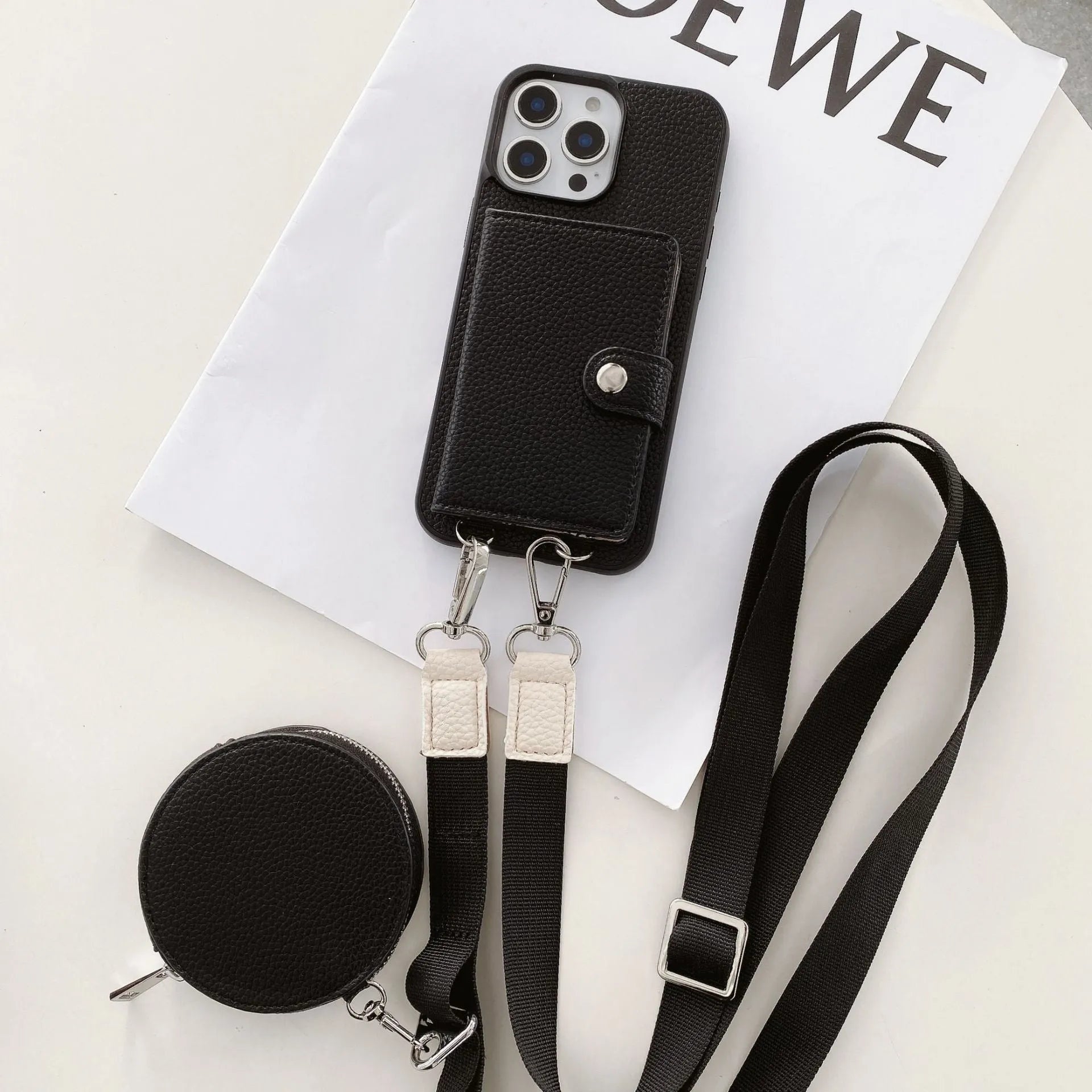 PC leather iPhone case with a card slot on the back and a lanyard loop, shown in multiple colours.