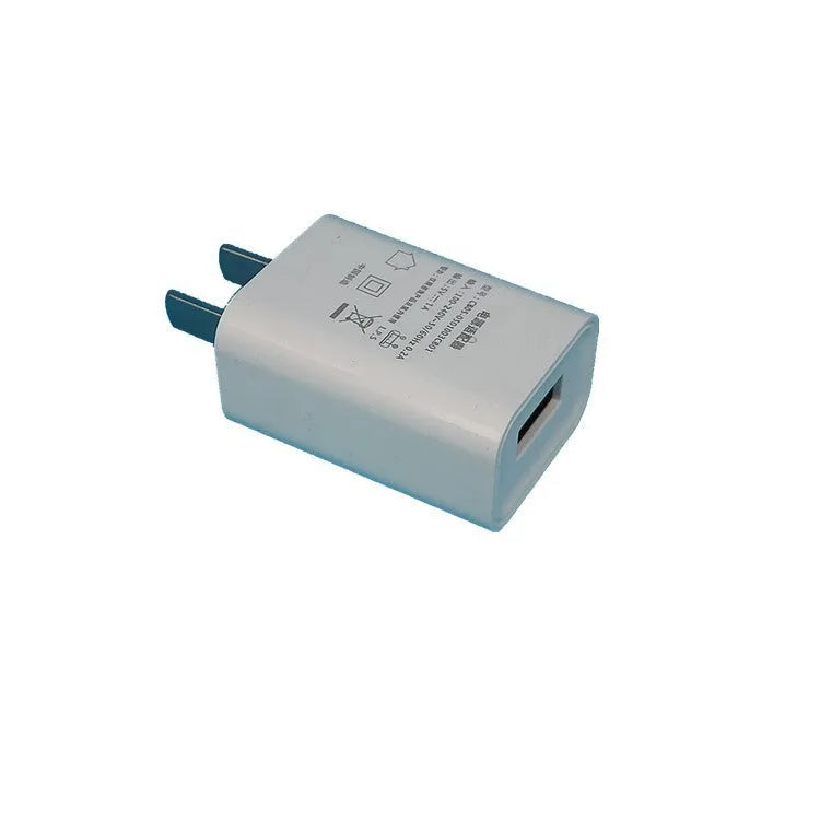 White slim USB charger with CE and FCC markings showing 5V-1A output specifications