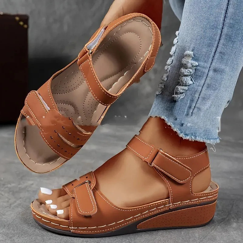 Women's thick bottom strap sandals with Velcro fastening in beige colour showing round toe and composite sole