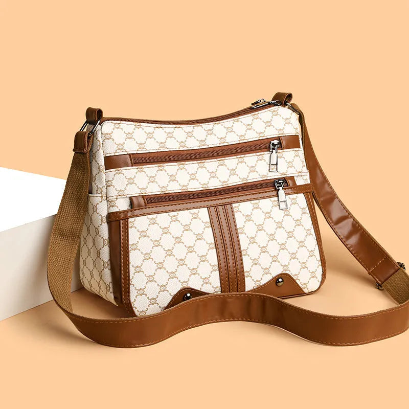 Brown women's crossbody bag with stitching pattern detail and large capacity interior