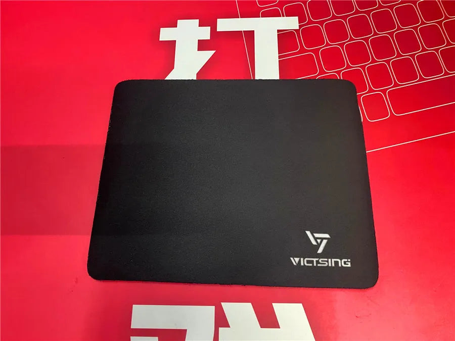 Black rough grain textured gaming mouse pad measuring 270mm by 220mm with a 5mm thick rubber base.