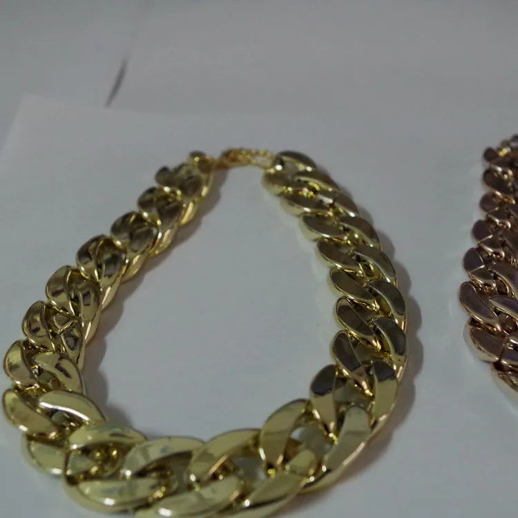 Gold-plated pet dog necklace with extender chain, gold finish, on a small dog