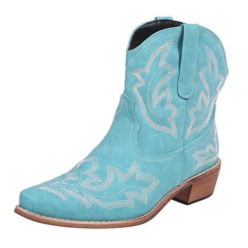 Women's blue embroidered cowboy boots with a low wedge heel and pointed toe.