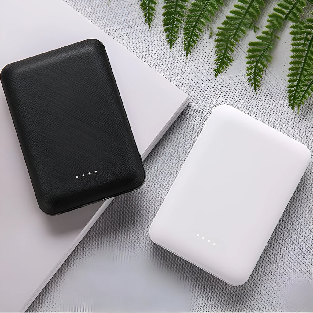 Black ultra-thin 10000mAh power bank showing dimensions and USB charging ports