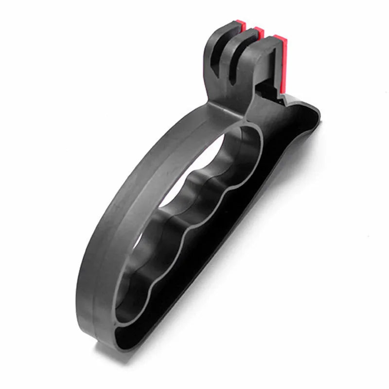Black handheld knife and scissor sharpener with ergonomic grip on white background