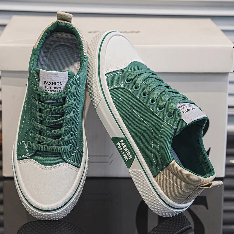 Men's low-top casual canvas skateboard shoes in blue with round toe and front lace-up closure.