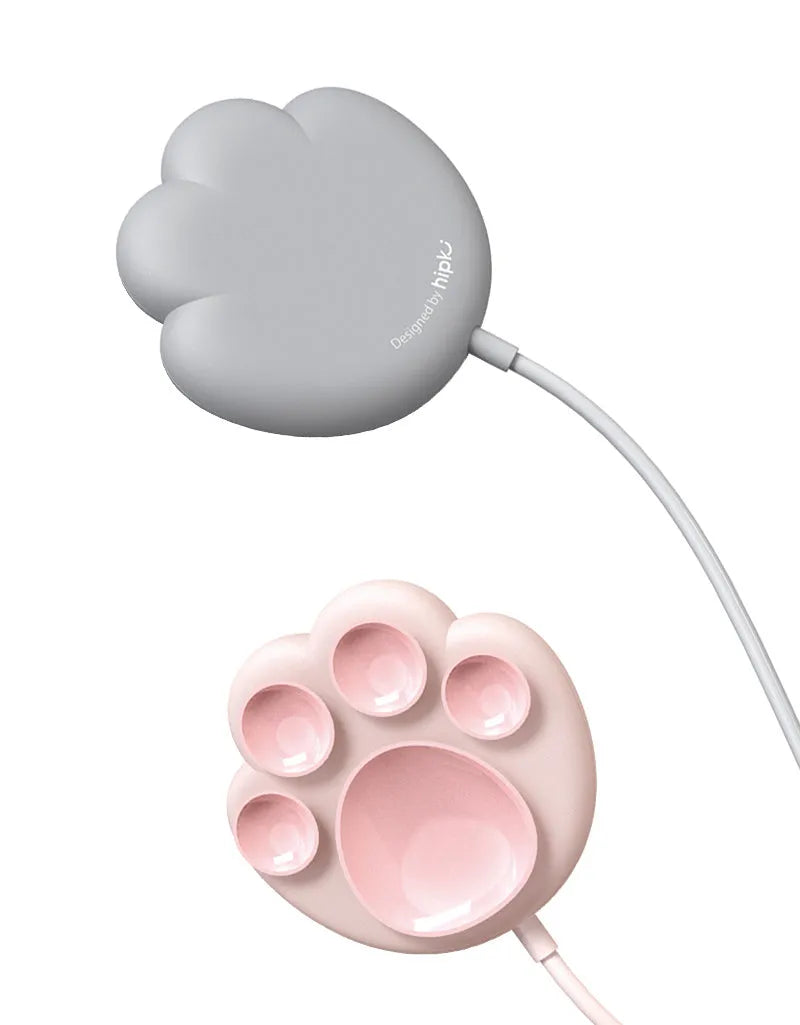 Pink cat claw sucker wireless charger on a desk with USB cable attached