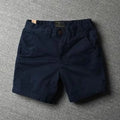 Men's straight-leg cotton casual shorts in camouflage green colour with zipper fly.