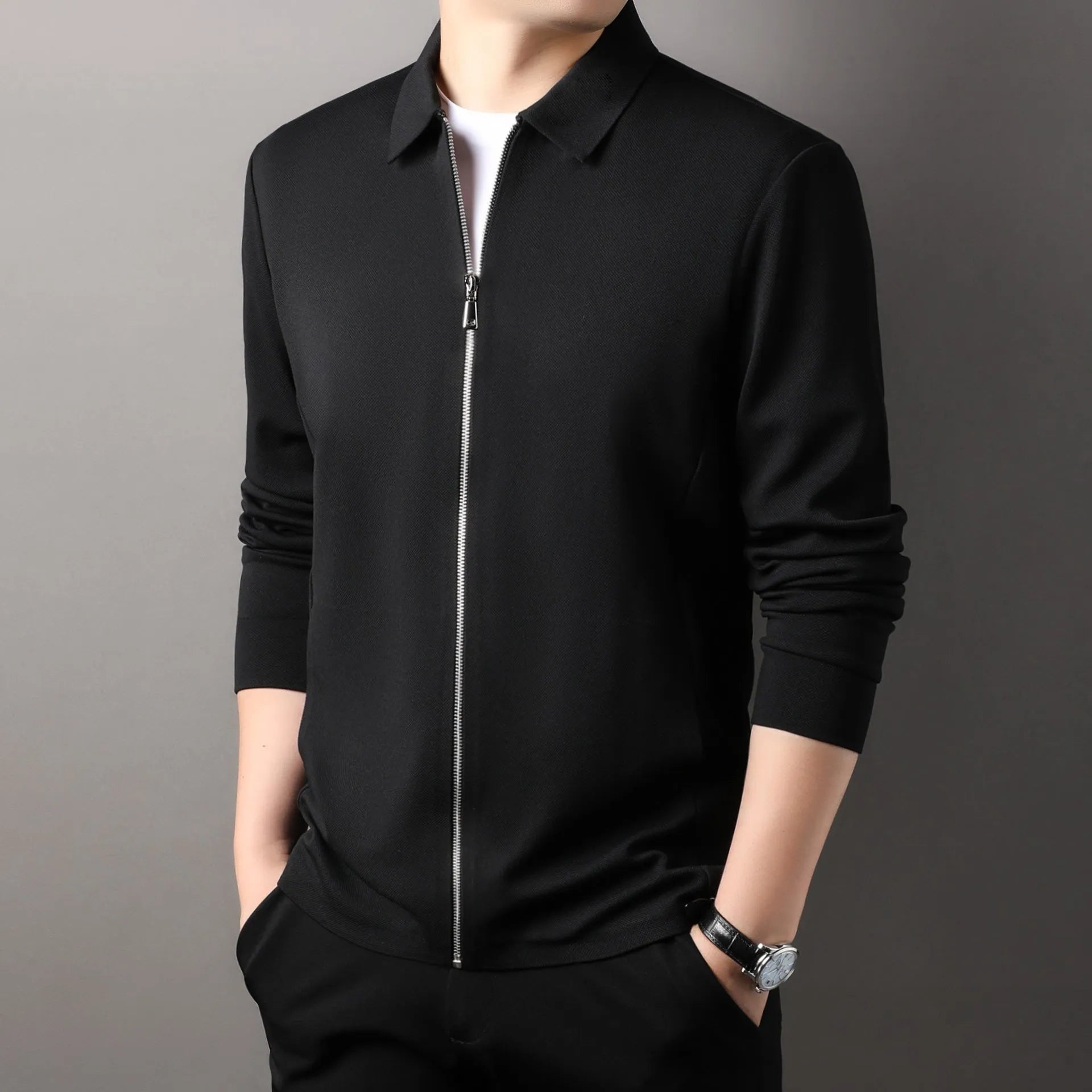 Men's straight hem polyester jacket in dark grey on a hanger.