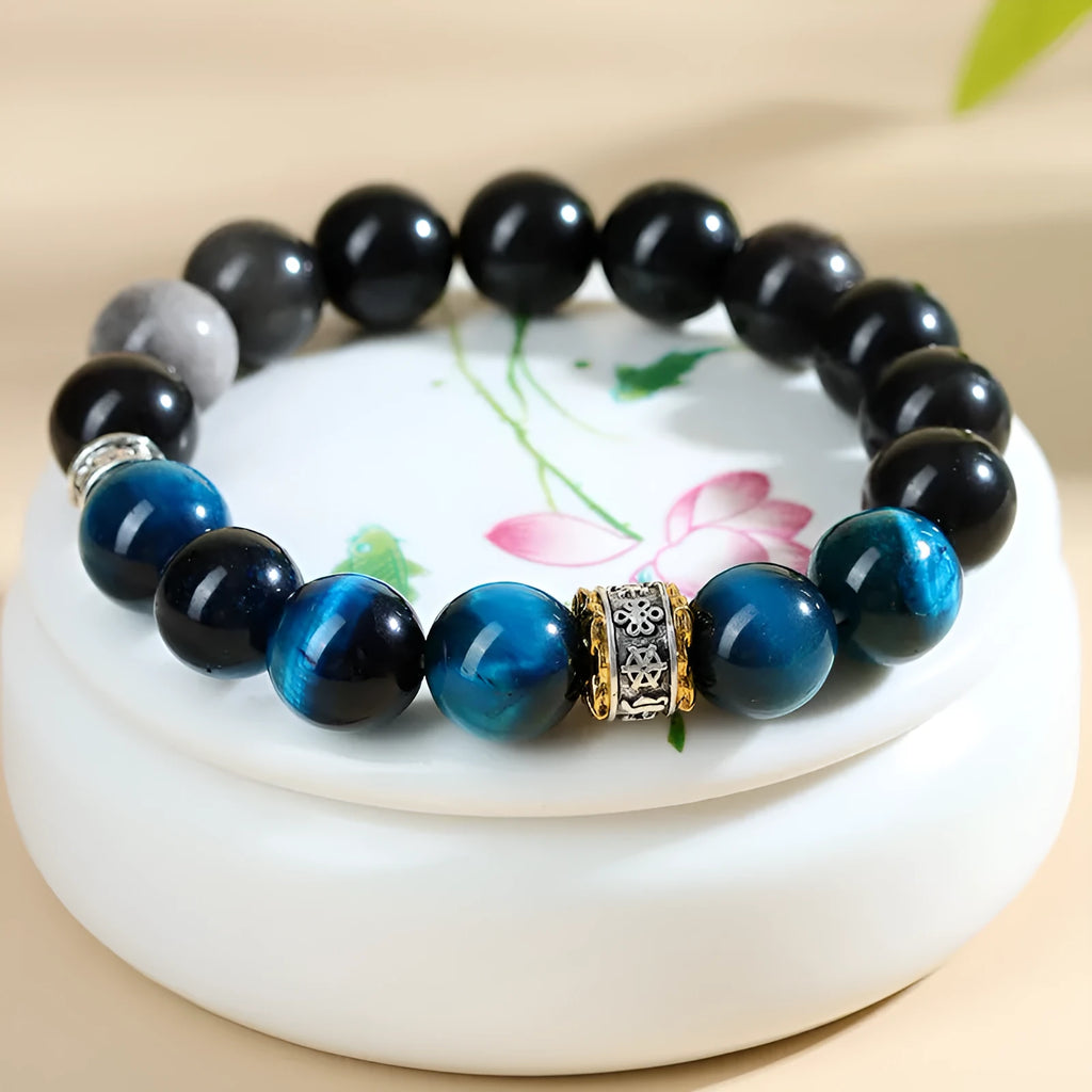Handmade peacock blue Tigereye bracelet with silver stone accents in geometric ethnic design