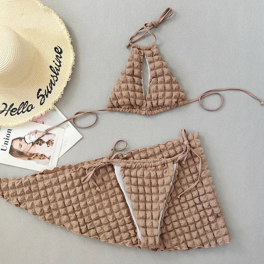 Brown seersucker three-piece bikini swimsuit with lace-up top, matching pants, and skirt for women