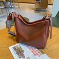 Women's genuine leather messenger bag in square vertical design with shoulder strap
