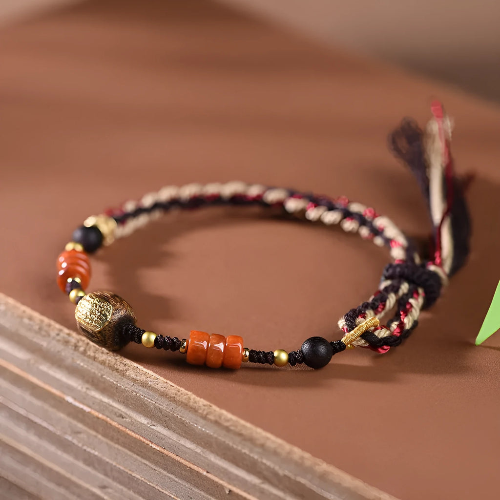 Hand-woven ethnic watch bracelet in flexible wire, showing Hongfei Ebony and Lapis Lazuli colour options.