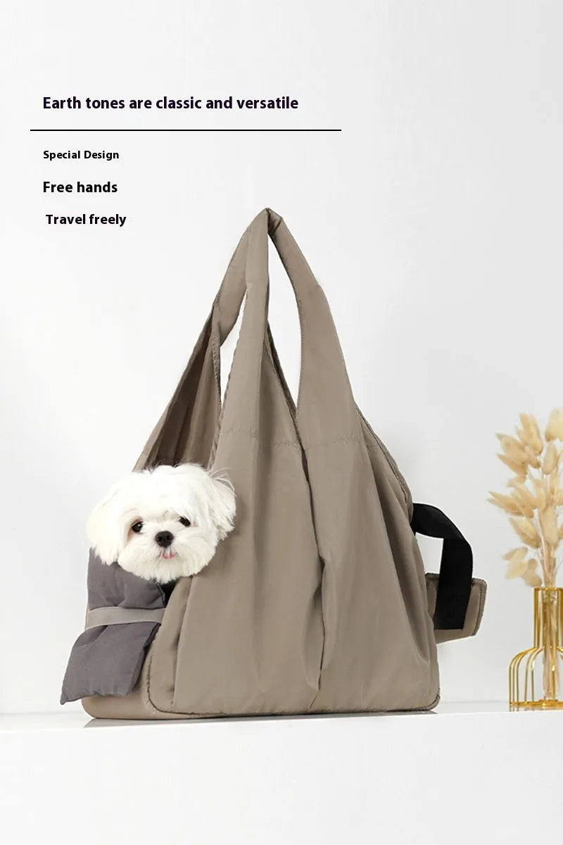 Apricot coloured cloth pet carrier handbag showing portable size.