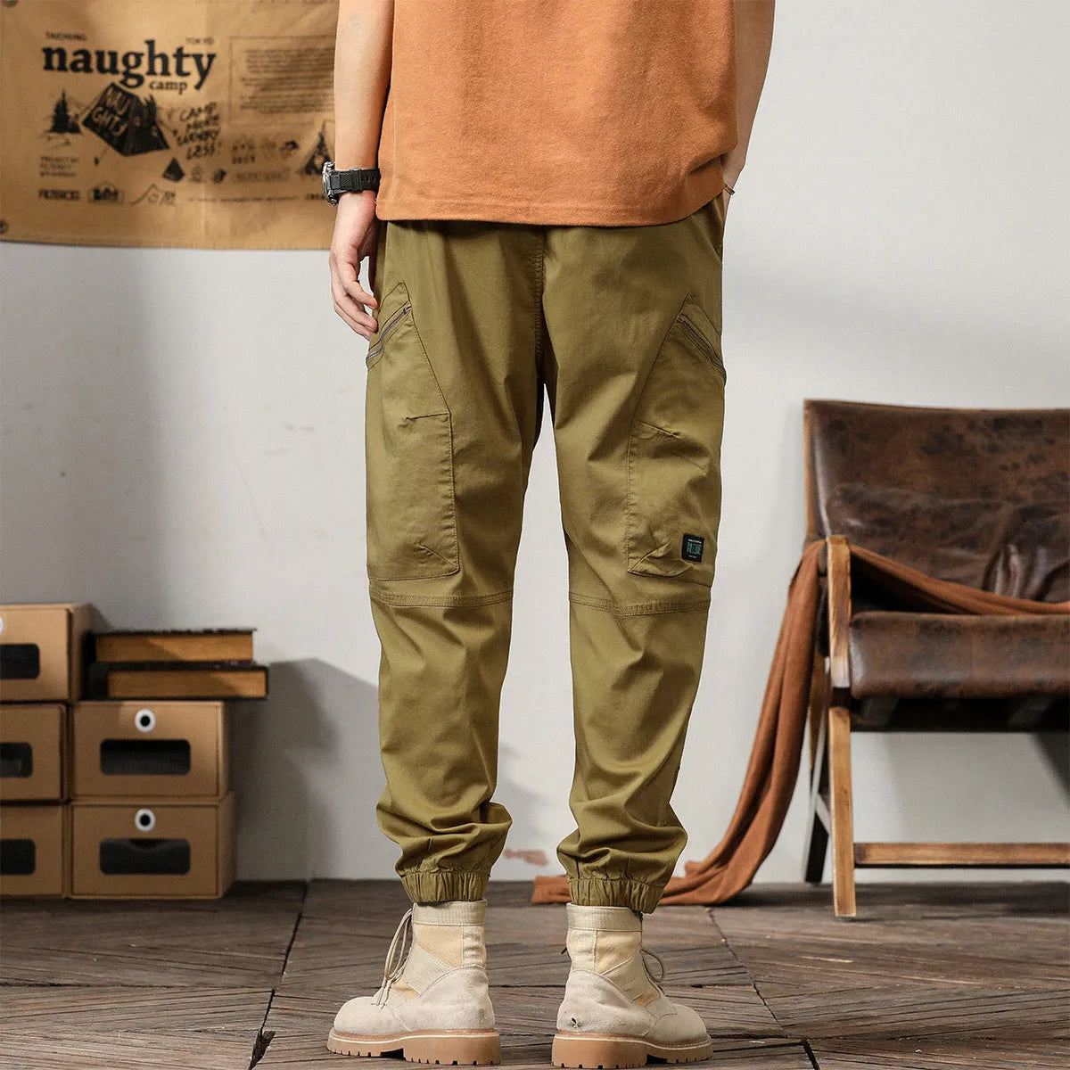 Men's cotton tapered harem trousers in black with elastic waistband and ankle band detailing