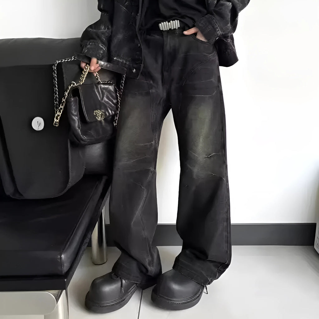 Mens washed black straight leg denim jeans with dirty mud texture and zip fly