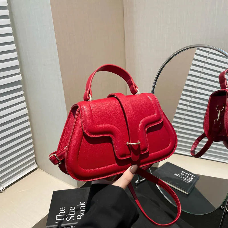 Simple PU shoulder bag in black, white or red with single strap and horizontal square shape.