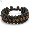A unisex Tiger's Eye gemstone bead bracelet with alloy details and auspicious elephant charms.