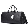 Men's black leather excursion bag showing single strap and large capacity design