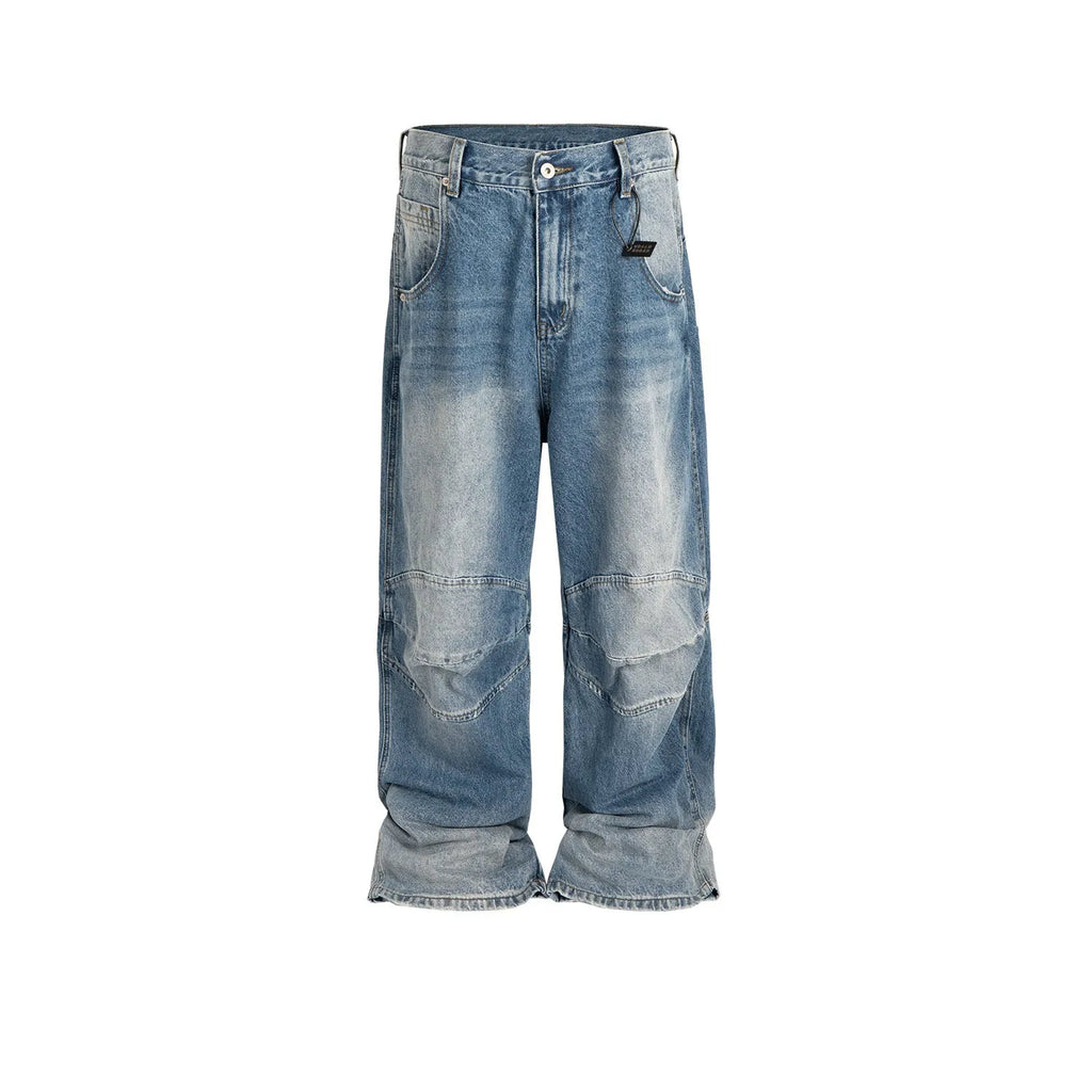 Men's blue white washed denim jeans with baggy cut and straight-leg design showing profile pleating details