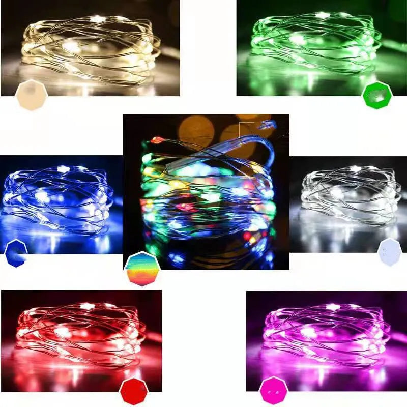 Copper wire string light with LED bulbs, battery box, and USB plug on a 12-metre cable.