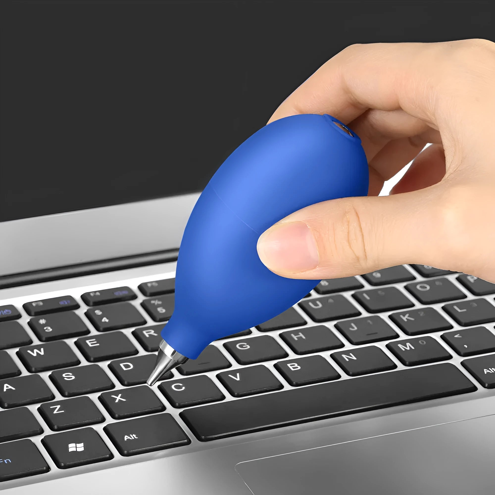 Blue and black rubber handheld air blower for dust removal on cameras and phones.