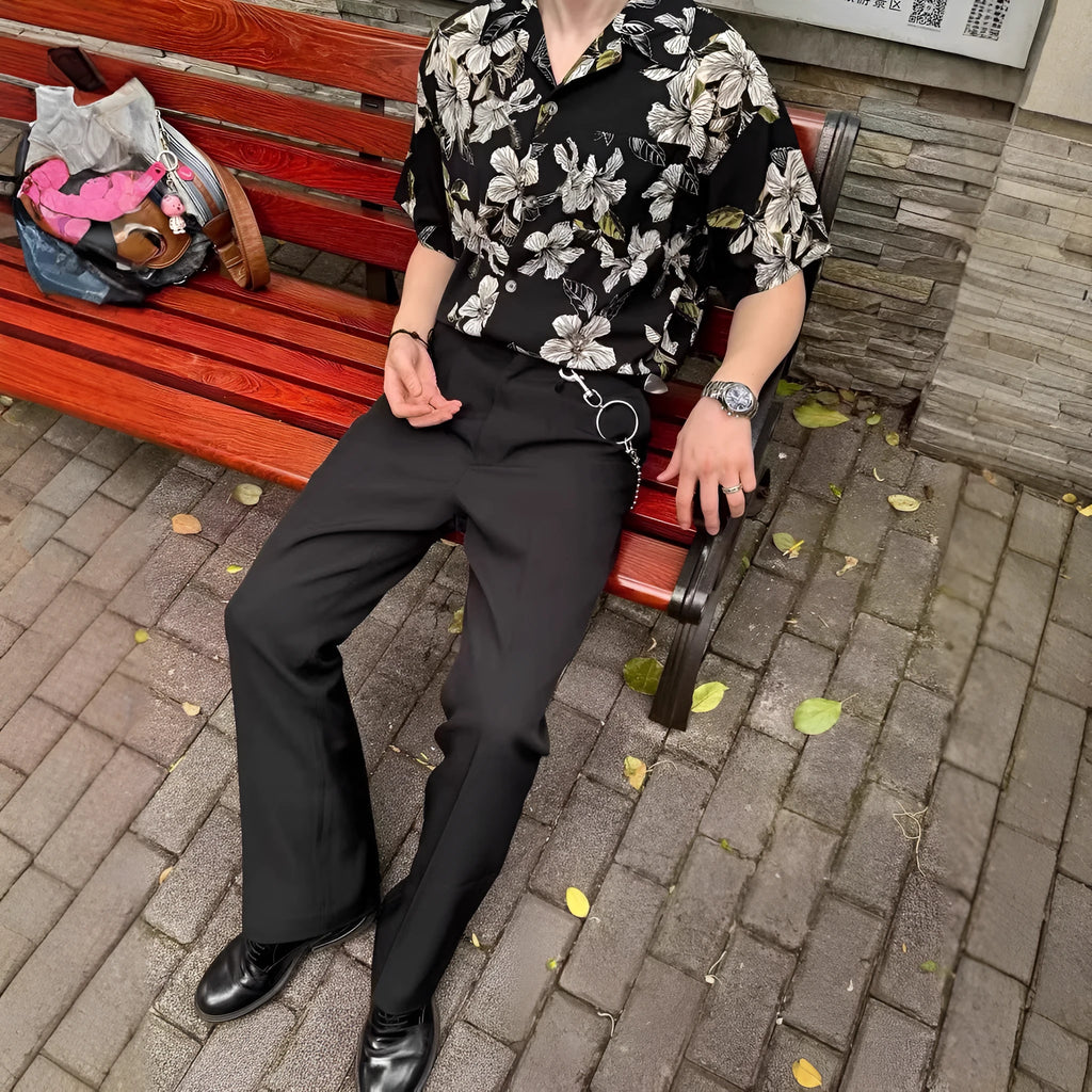 Black men's short-sleeve Cuban collar shirt with floral print, made from ice silk fabric.