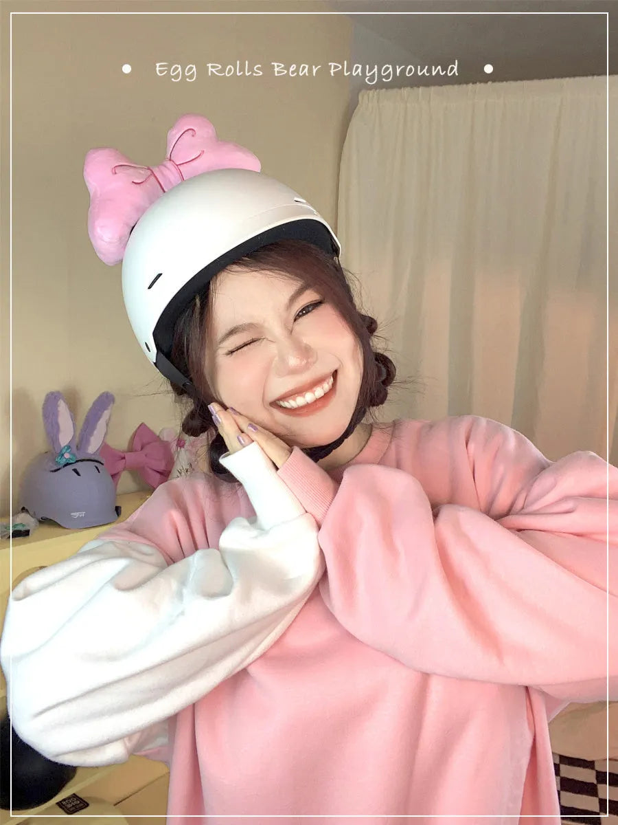 Soft plush bow helmet decoration with elastic loop in red, peach pink, or rose pink.