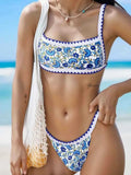 Green polyester bikini set with backless briefs style on a mannequin.