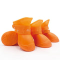 Set of four colourful rubber pet rain shoes with soft soles for dogs or cats.